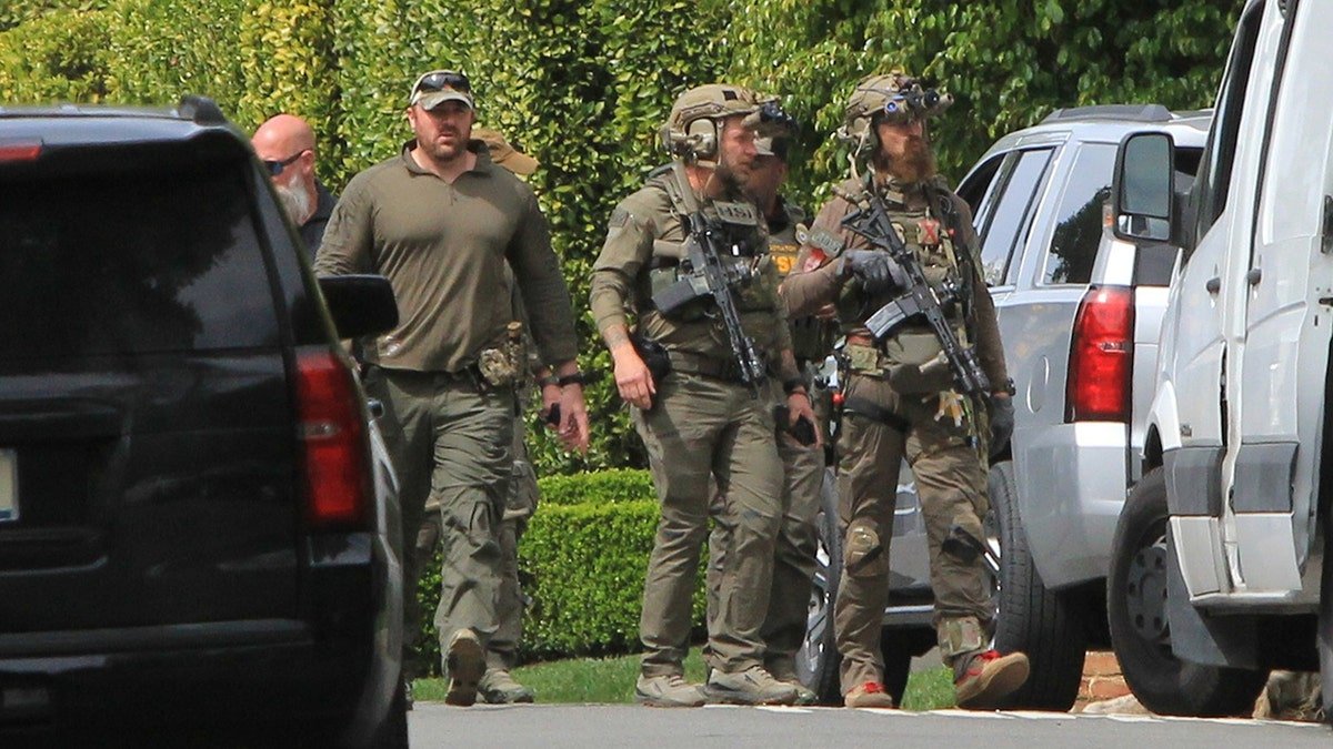 Men in uniform with massive guns hangout around Diddy's home in Beverly Hills