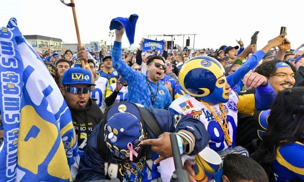 Fans reacts as the Los Angeles Rams pick DE Jared...