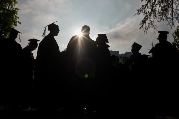 Graduates at Cal State Northridge march into graduation Ceremonies on...