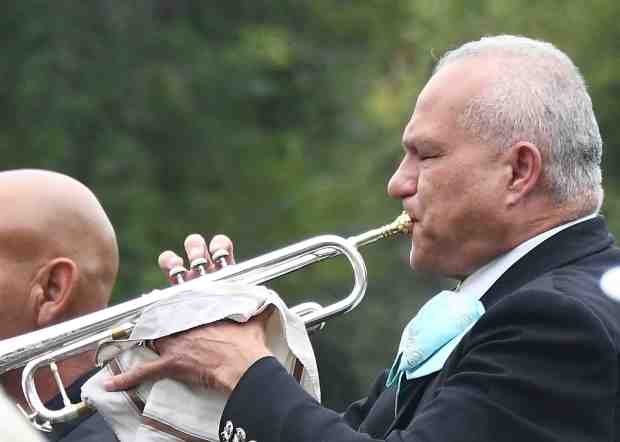 Trumpet player Stan Leandro plays “TAPS” during its 17th annual...