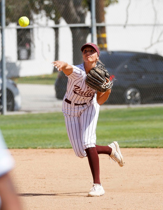 Valley Christian’s Britton Brown throws to get the out at...