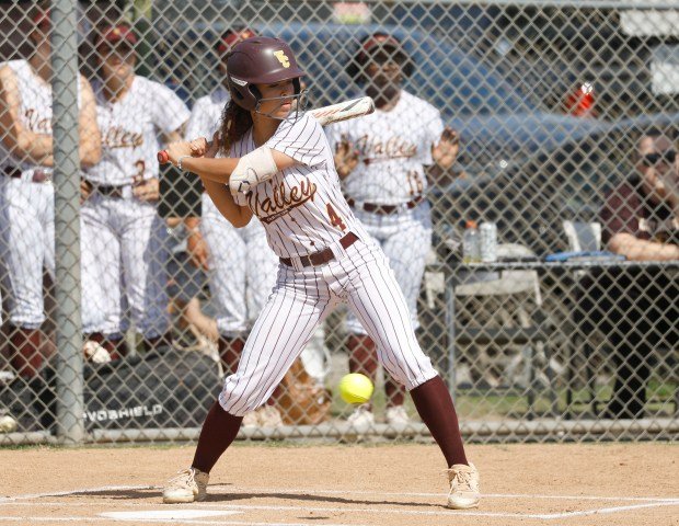 Valley Christian’s Choyce Chambers waits for her pitch as they...