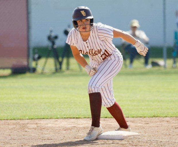 Valley Christian’s Peyton Kingery looks for her chance to steal...