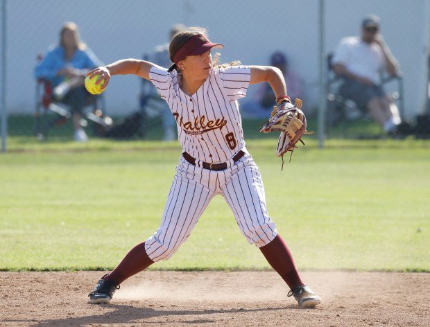 Valley Christian’s Lydia Dietz looks to get the out at...