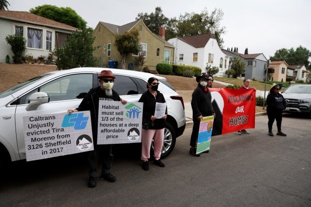 A group representing Reclaiming Our Homes rallied outside the San...