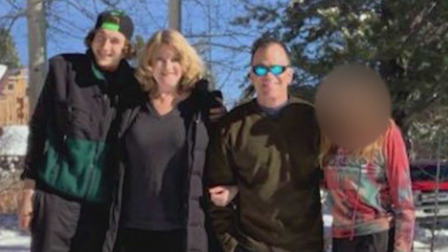 Vince and Karyn Lombardo are seen with their two children in a family photo.