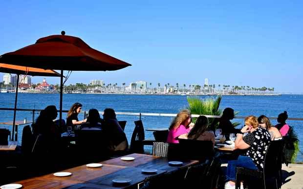 Outdoor dining at Fuego in the Hotel Maya in Long...