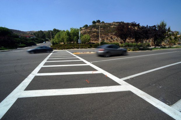 On Oct. 1, 2020, cars pass by the crosswalk at the intersection of Triunfo Canyon Road and Saddle Mountain Drive where Mark and Jacob Iskander were struck and killed on Sept. 29, 2020, by a vehicle in Westlake Village. Rebecca Grossman, a co-founder of the Grossman Burn Foundation, was convicted of second-degree murder, vehicular manslaughter with gross negligence and  hit-and-run driving in connection with the boys' deaths. She awaits sentencing in Van Nuys on June 10, 2024. (Photo by Andy Holzman/Contributing Photographer)