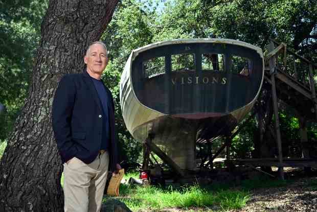 Kevin Heerdt with his father’s unfinished boat, Visions, in Trabuco...