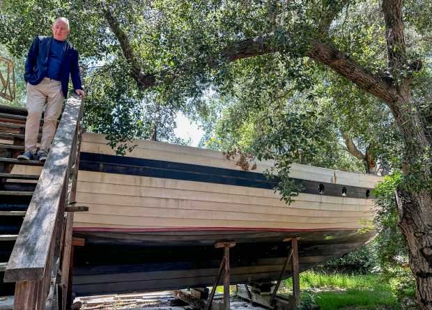 Kevin Heerdt with his father’s unfinished boat, Visions, in Trabuco...