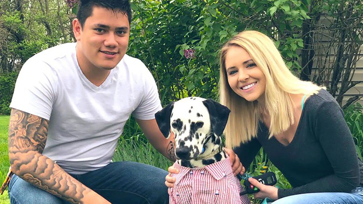 Payton Shires, 24, poses with dog.