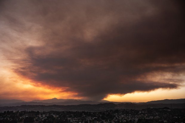 Smoke rises from the Post fire near Gorman, CA, causing...