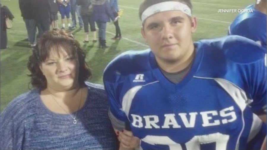 Ian Pangburn, who played football in high school, is seen with his mother in a family photo. (Pangburn Family)