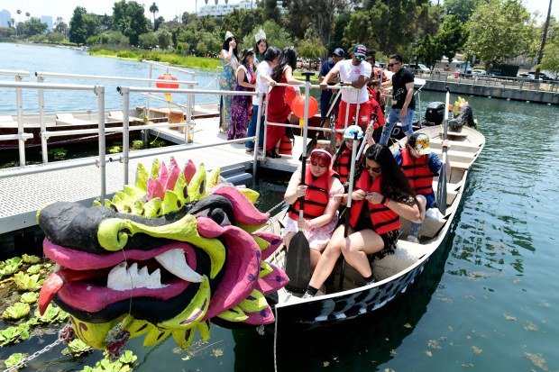 Dragon boats ferry people for a ride on the lake...