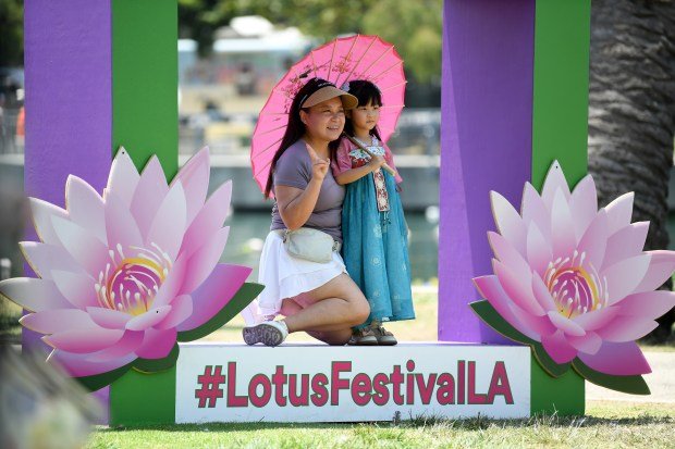 Nam Jiang and her daughter Ella, 5, hang out at...