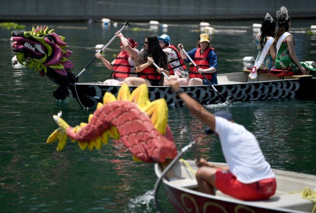 Dragon boats ferry people for a ride on the lake...