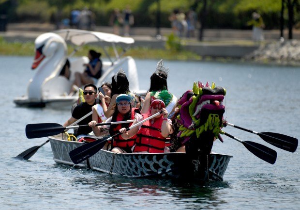 Dragon boats ferry people for a ride on the lake...