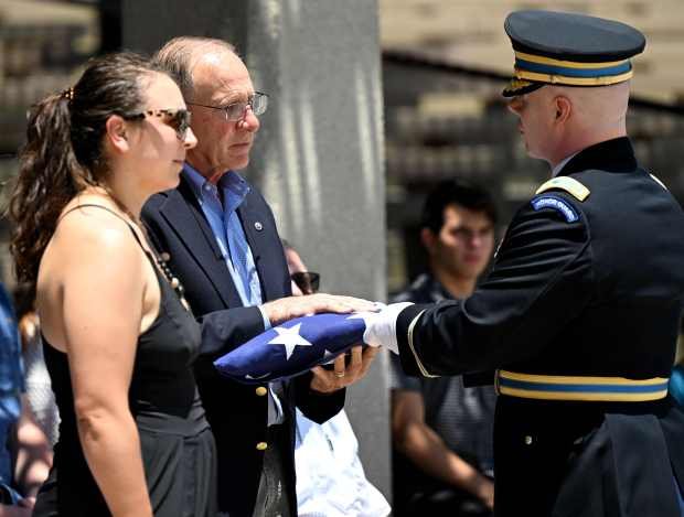 Dave Powers, second from left, and nephew of U.S. Army...