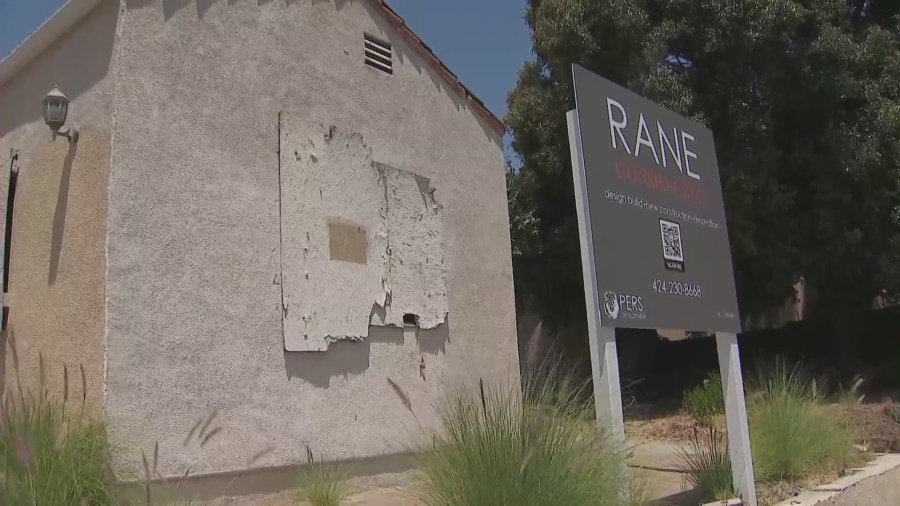 A West Hollywood home remains boarded up on July 2, 2024 after a large fire  was ignited amid complaints of squatters constantly trespassing. (KTLA)