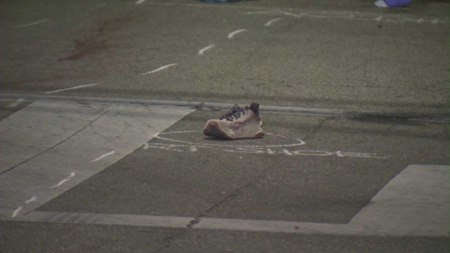 The victim's running shoe can be seen at the crash site. (KTLA)