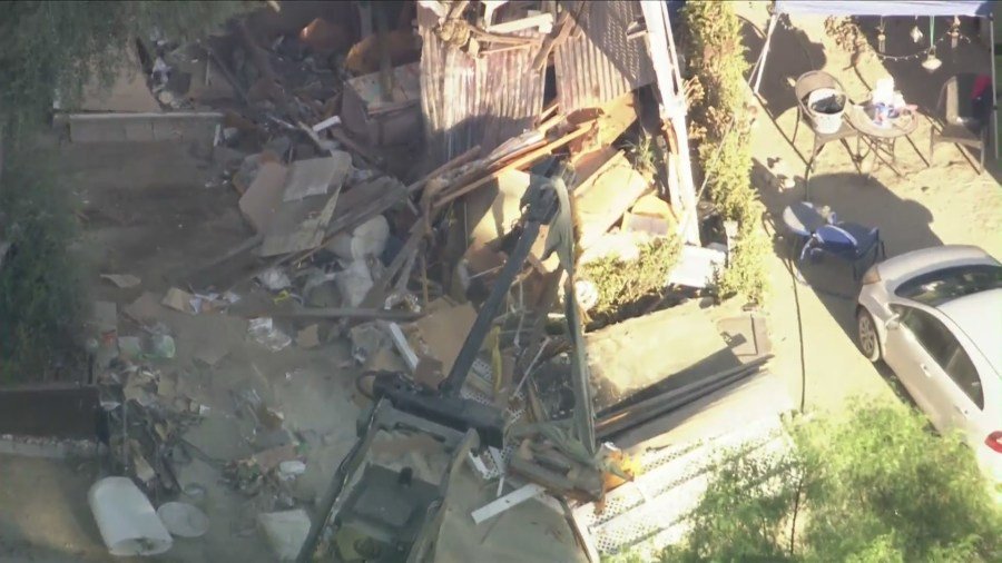 The home of the missing couple's next-door neighbor was raided and destroyed by SWAT Team members and law enforcement on August 29, 2024. (KTLA)