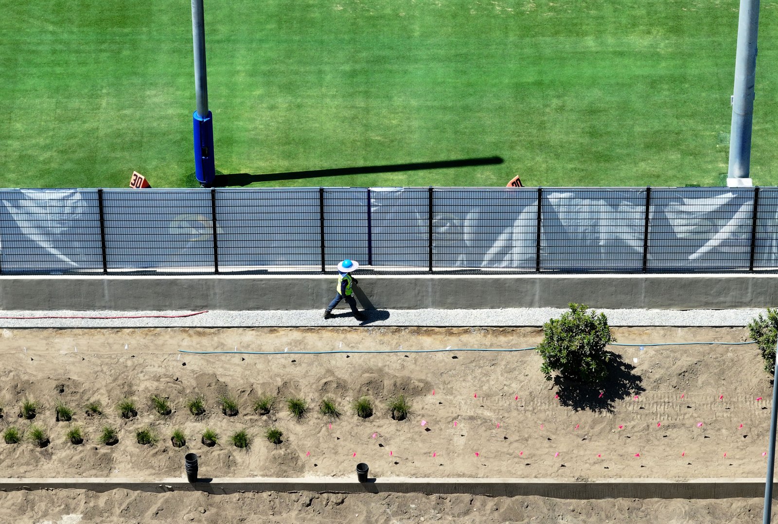 A landscape worker at the new Los Angeles Rams training...