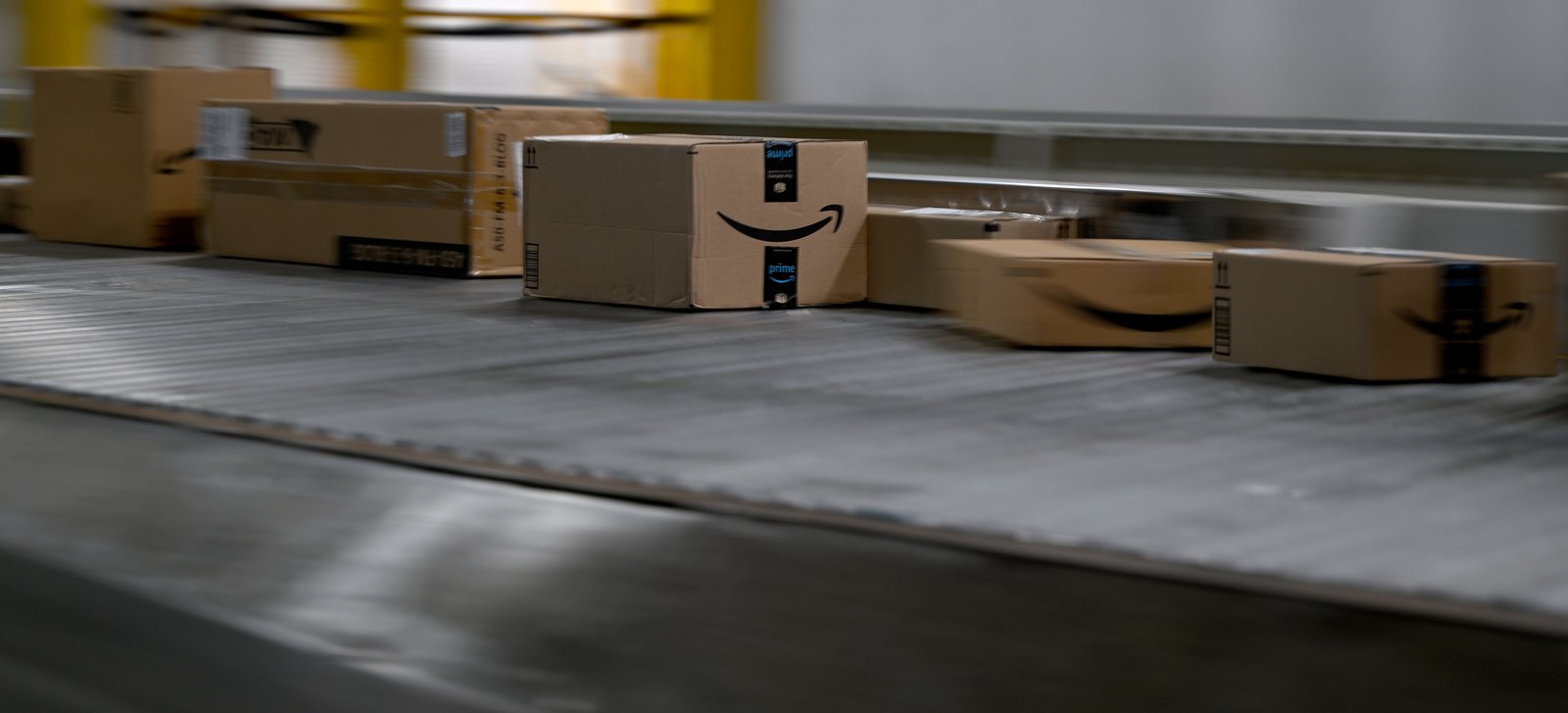 Packages move along a conveyor belt for sorting at the...