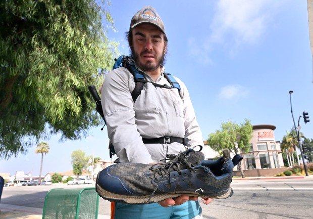 Ranger Kielak shows one of the shoes that he wore...