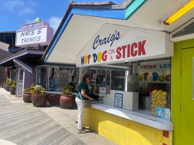 A customer orders at Craig’s Hot Dog on a Stick...