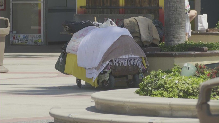 Homeless residents seen at the Newport Beach Pier area on August 29, 2024. (KTLA)