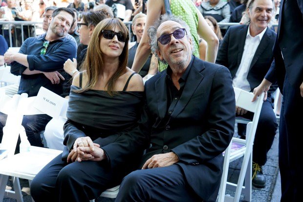 Monica Bellucci, left, and Tim Burton arrive at a ceremony...