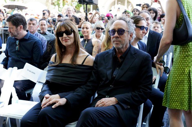 Monica Bellucci, left, and Tim Burton arrive at a ceremony...