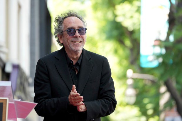 Tim Burton arrives at a ceremony honoring him with a...