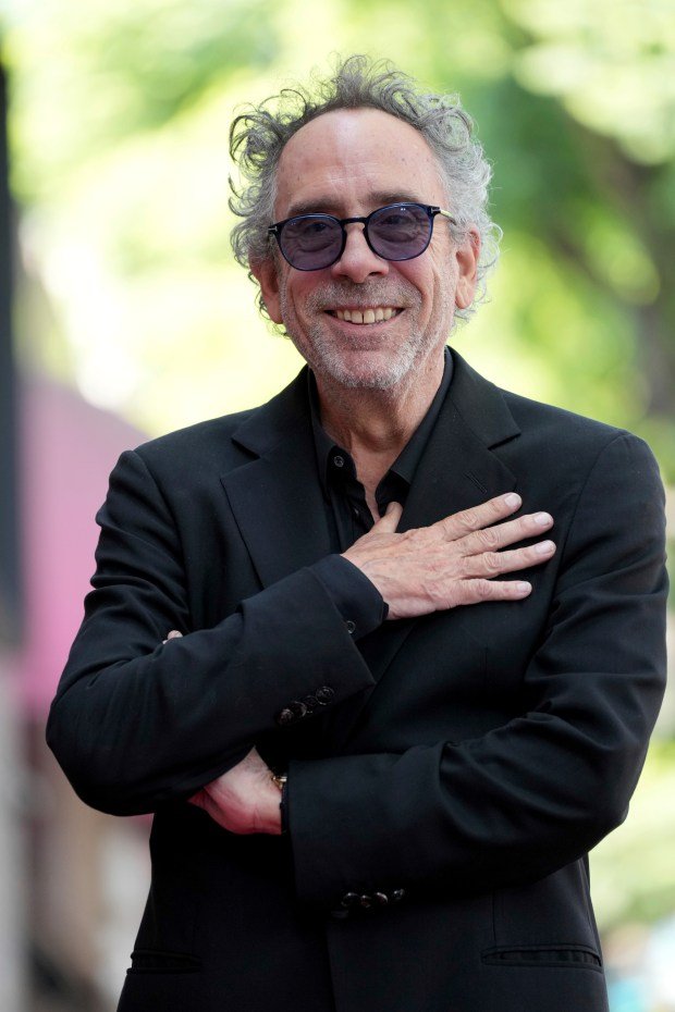 Tim Burton arrives at a ceremony honoring him with a...