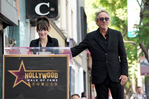 Winona Ryder, left, and Tim Burton arrive at a ceremony...