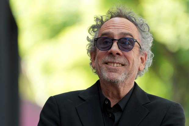 Tim Burton arrives at a ceremony honoring him with a...