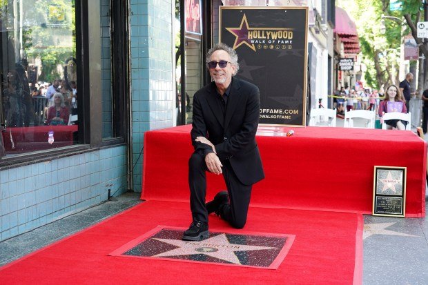 Tim Burton arrives at a ceremony honoring him with a...