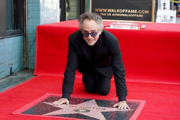 Tim Burton arrives at a ceremony honoring him with a...