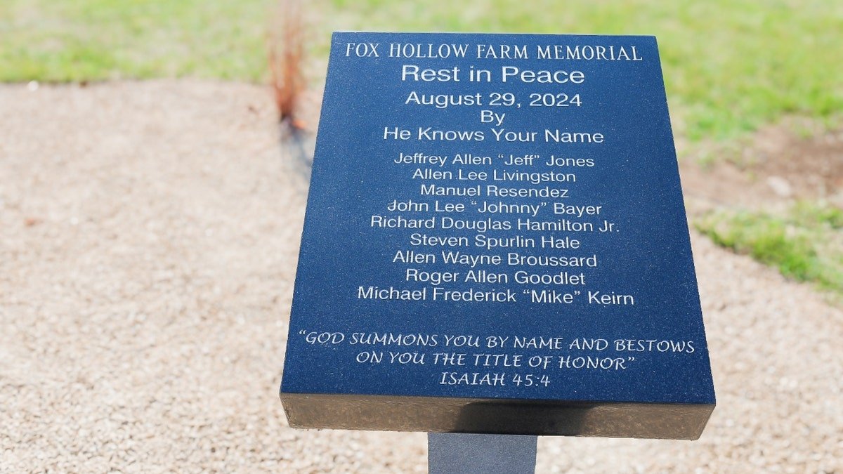 A memorial lists the names of the nine identified victims of the Fox Hollow Farms killings