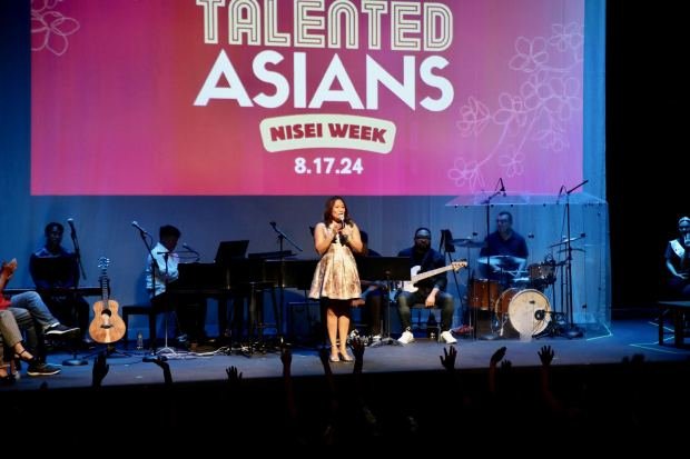 Lily Tung Crystal, the artistic director for East West Players, an Asian American theater group in Little Tokyo, greets a sold-out crowd on Saturday, Aug. 17, 2024, at the David Henry Hwang Theatre in Los Angeles. (Photo by Howard Freshman, Contributing Photographer)