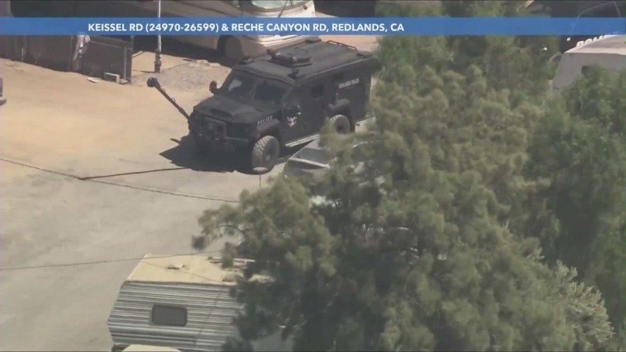 A SWAT Team's armored vehicle arrived to execute a search warrant at the suspect's home on August 29, 2024. (KTLA)