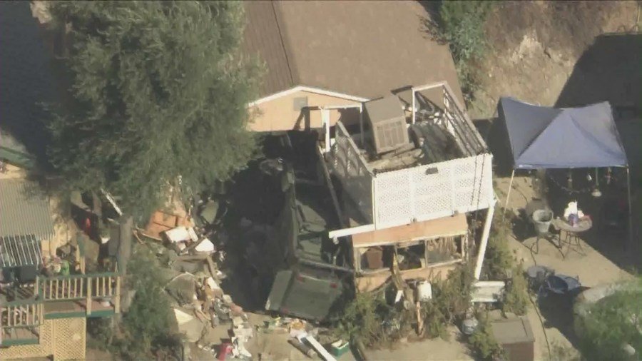 The home of the missing couple's next-door neighbor was raided and destroyed by SWAT Team members and law enforcement on August 29, 2024. (KTLA)