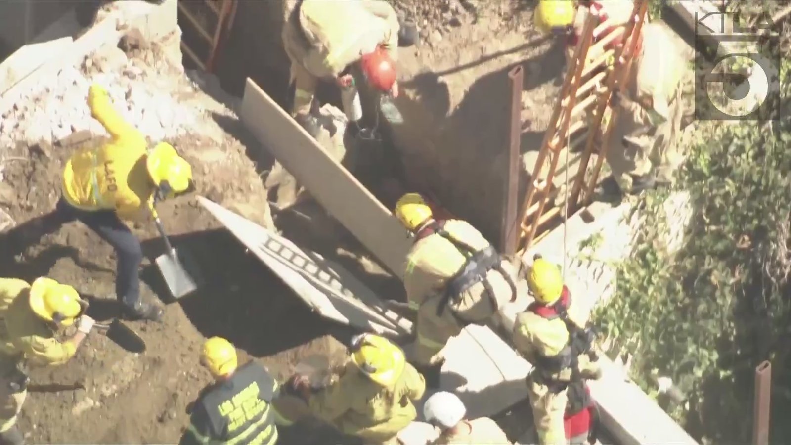 Los Angeles Fire Department crews worked quickly to dig out a man who was trapped in en eight-foot trench in Los Feliz on Sept. 5, 2024. (KTLA)